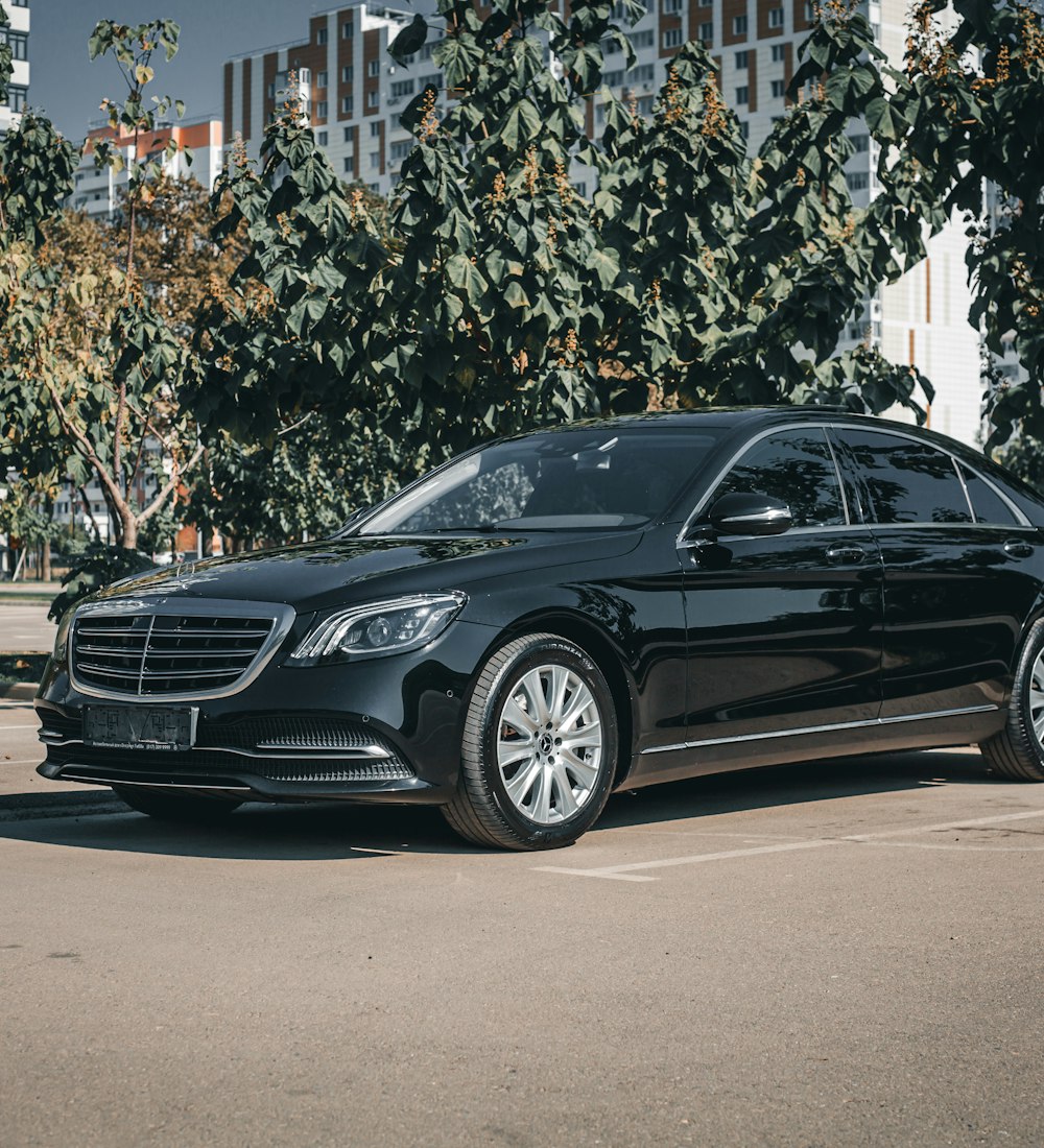 Black chauffeur-driven sedan used for airport transfer service